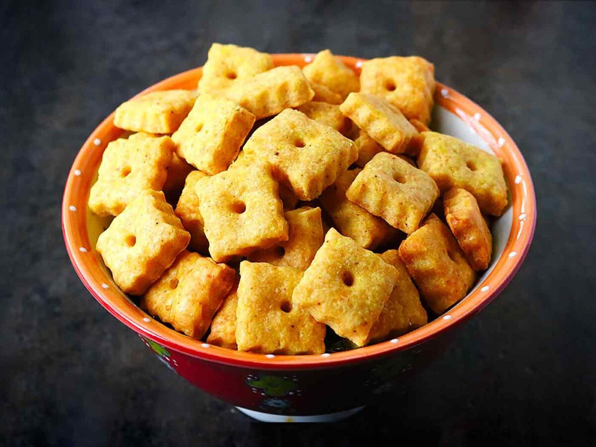 Homemade Cheez Its Crackers in a red bowl.