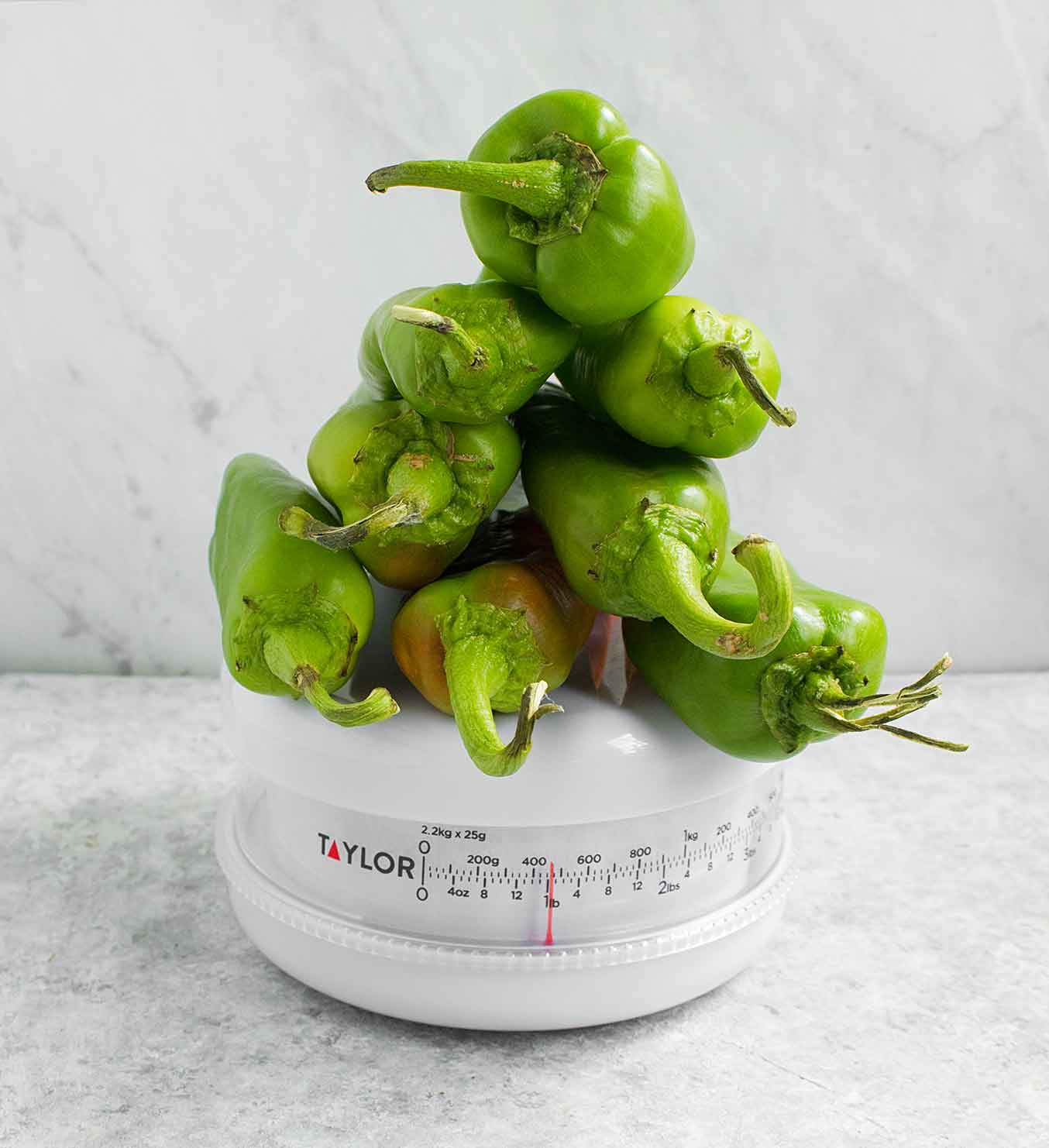 Hatch chiles on a scale, to equal a pound