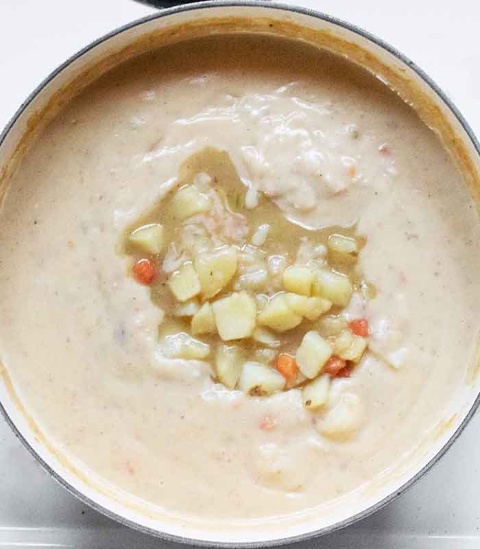 Reserved potato chunks added back to the partially blended soup.