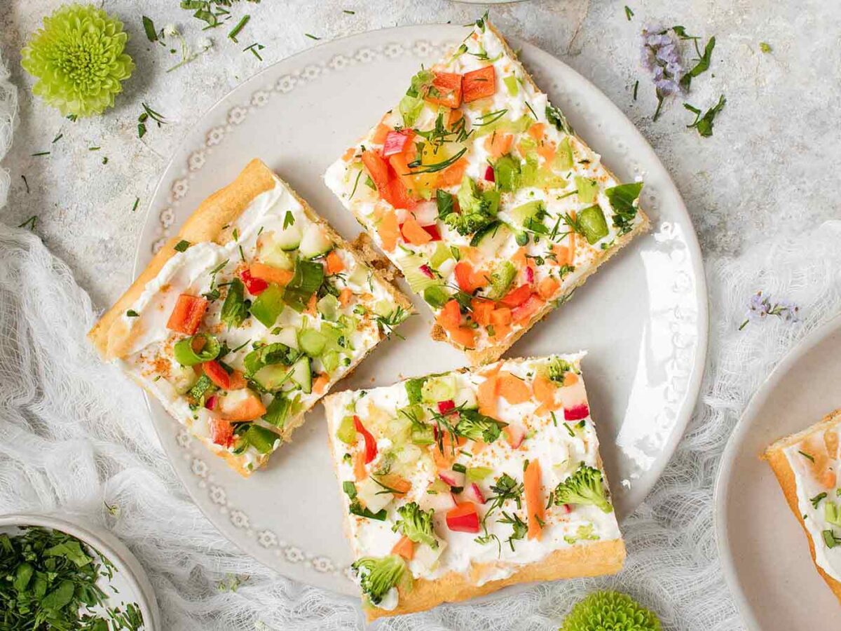 Three slices of Ranch Veggie Pizza on a plate.