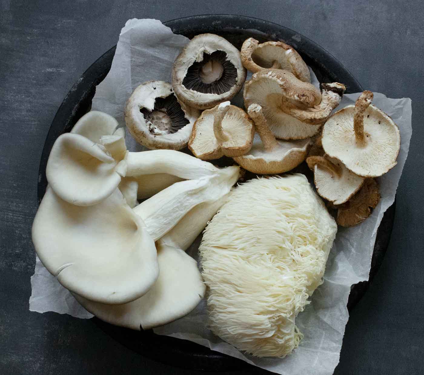 Mushrooms for the soup arranged on a metal plate.