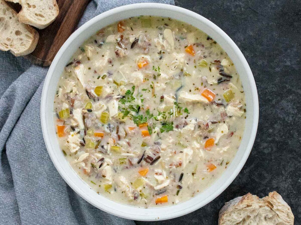 Leftover Turkey & Wild Rice Soup in a white bowl.