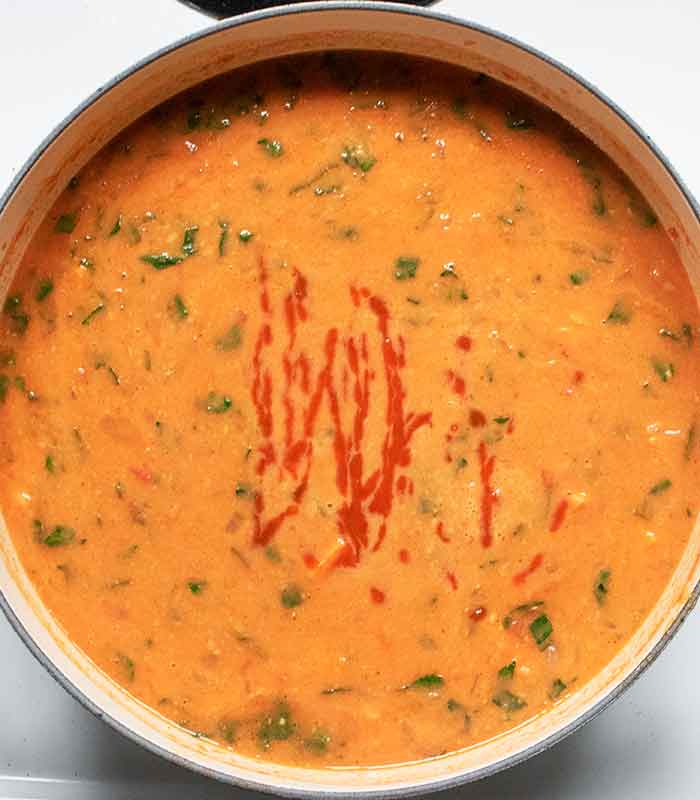 Season with sriracha, and serve with toppings.
